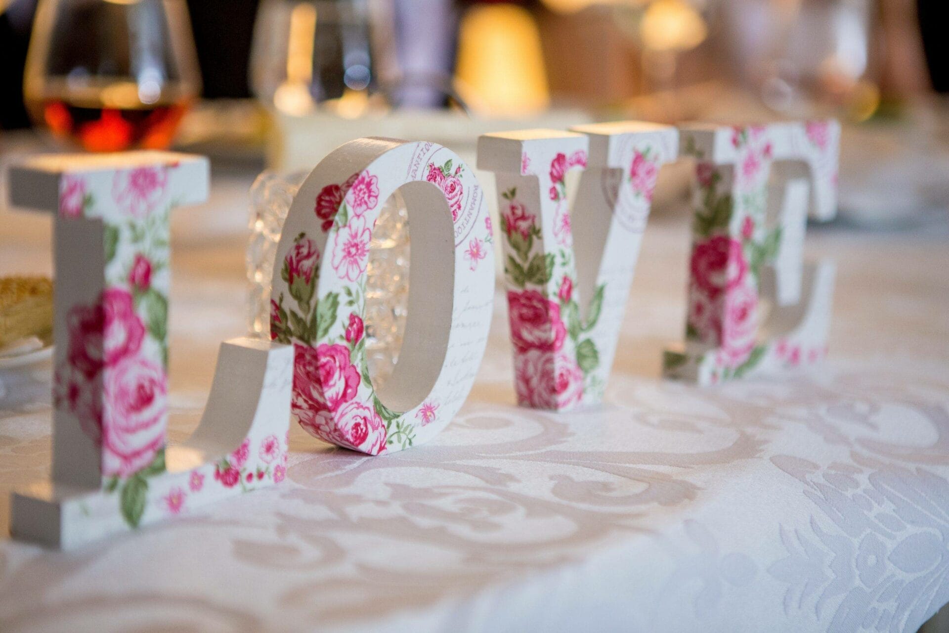 Love letters on a table with flowers on them.