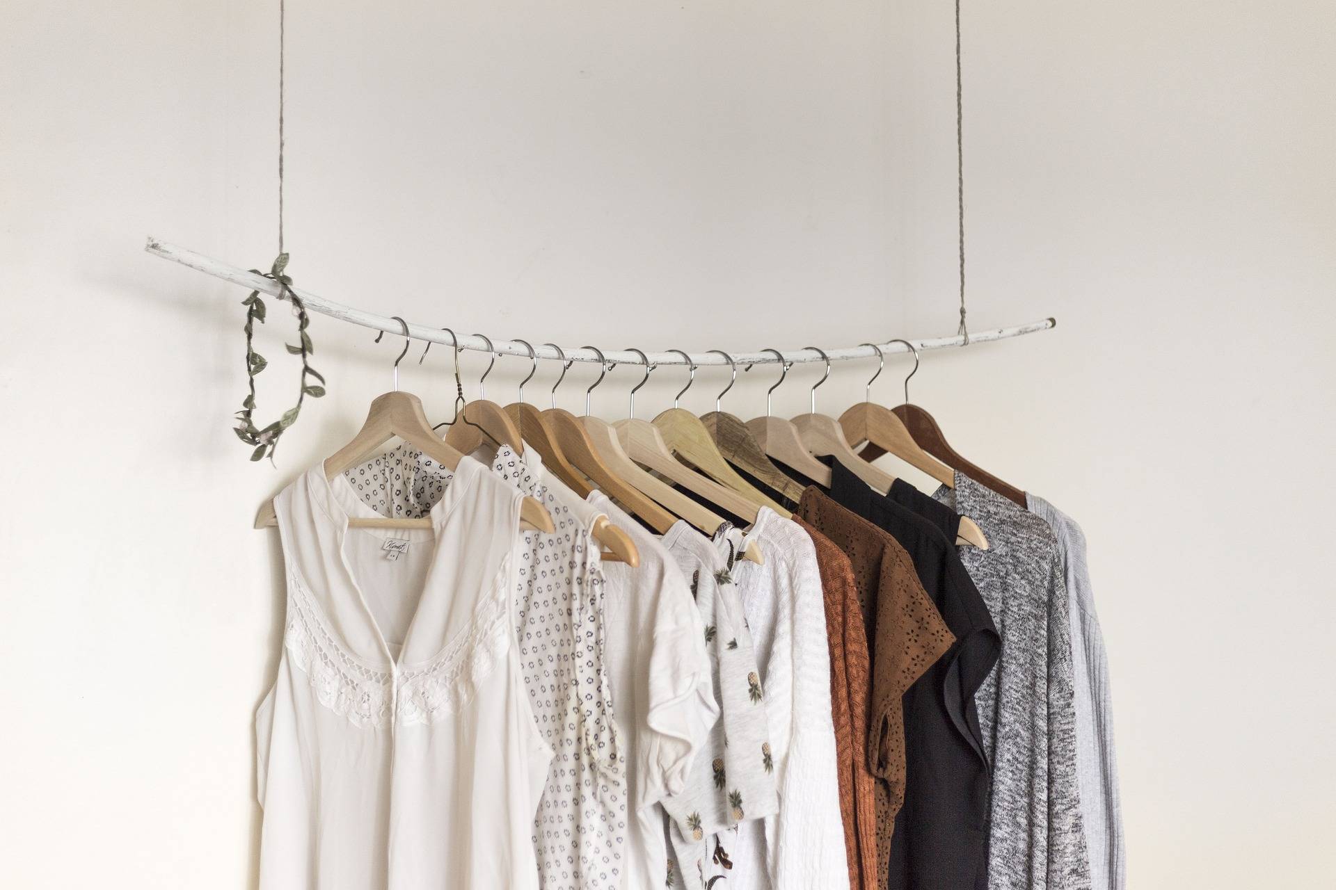 A rack of clothes hanging on a wall.