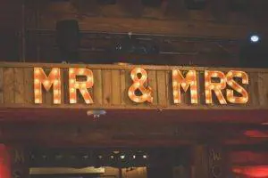 A wooden sign that says mr and mrs.