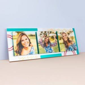 A graduation photo frame with three photos on it.
