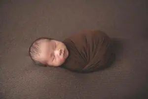 newborn photography, newborn in a wrap pose