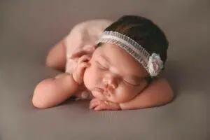 newborn photographer in studio, posed with a headband, Saint Paul, MN