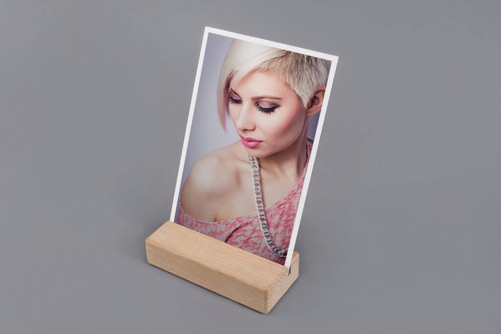 A wooden frame with a picture of a woman on it.