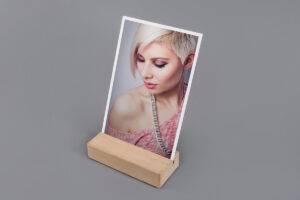 A wooden frame with a picture of a woman on it.