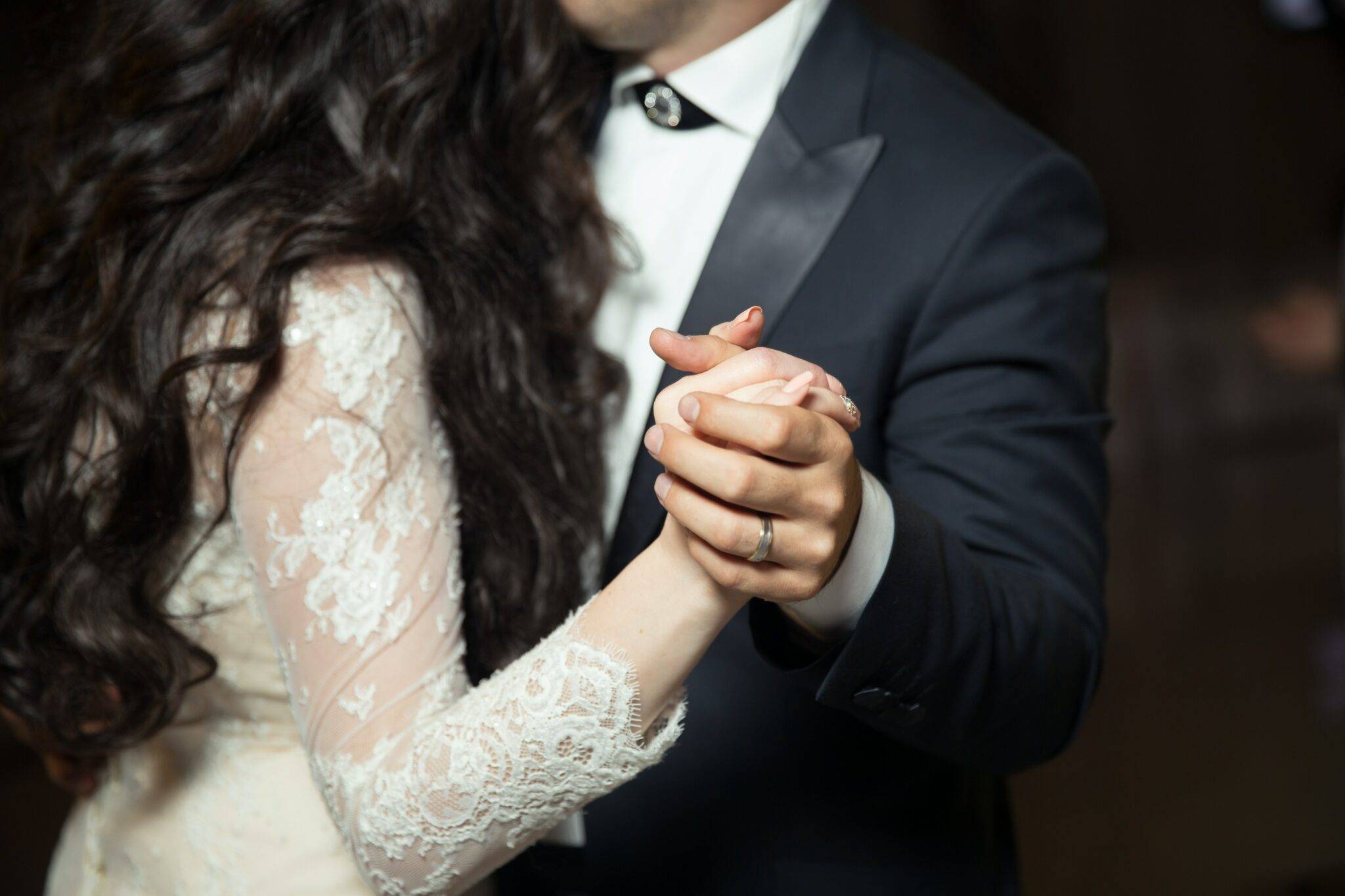 A bride and groom dancing at a wedding.