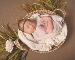 newborn baby girl in a basket, photography