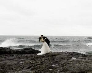wedding photography bride and groom kissing along the north shore in lake superior, duluth, mn