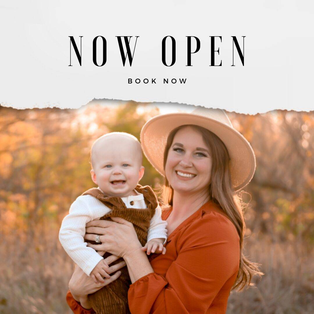 A happy woman wearing a hat holds a smiling baby, both in autumnal setting, with text overlay stating "now open book now".