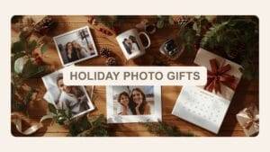 Photographs, a photo mug, a camera, and a custom calendar arranged on a wooden table with holiday greenery and a wrapped gift. Text overlay reads “Holiday Photo Gifts.”.