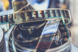 Vintage film strips and canisters representing the analog photography revival