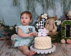 Baby's first birthday with a clean minimalist white rosette cake smash