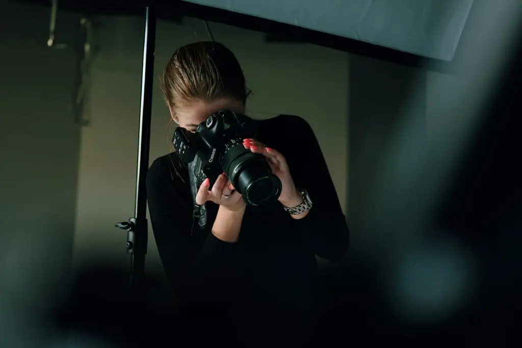 Photography student learning to use a camera