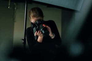 Photography student learning to use a camera