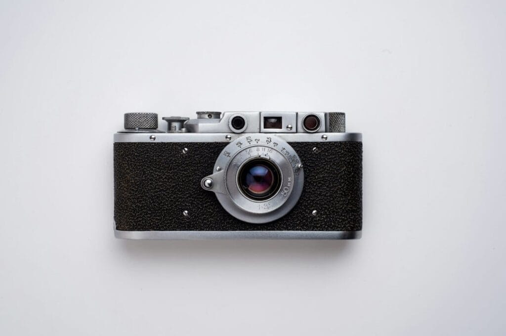 Vintage rangefinder film camera representing analog photography and the choice between film and digital gear
