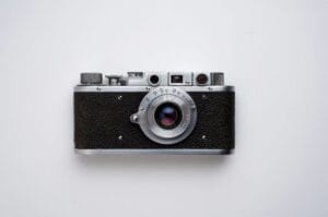Vintage rangefinder film camera representing analog photography and the choice between film and digital gear