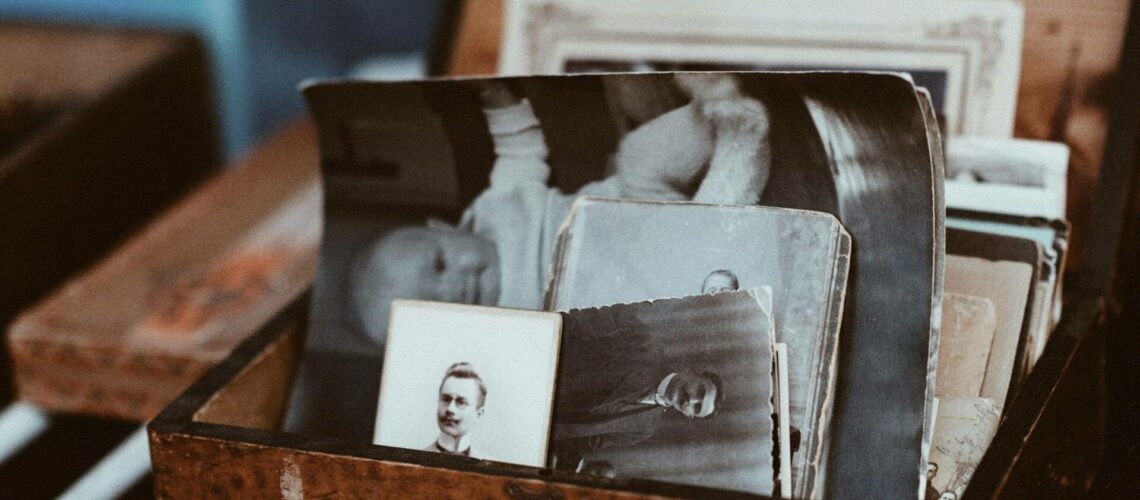 A wooden box filled with old photos.